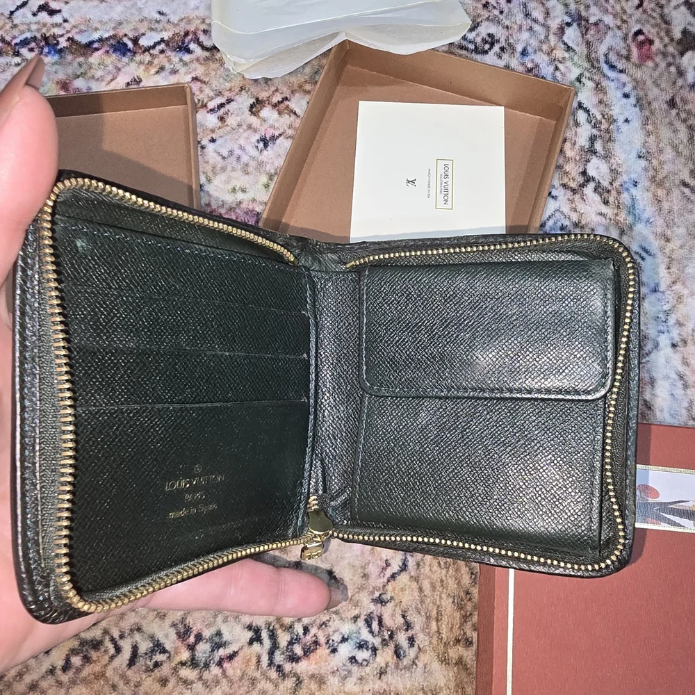 Full Inclusion Louis Vuitton Green Tiaga Zip Around Organizer. COA Included